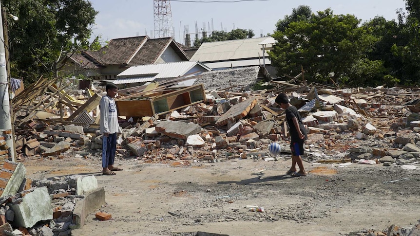 Kids play soccer among the rubble in the aftermath of the Lombok earthquakes