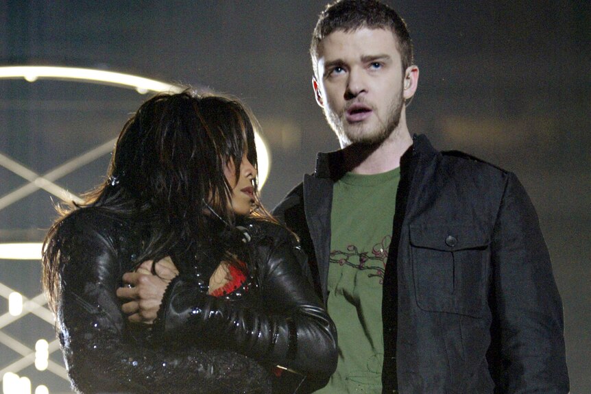 Janet Jackson on stage with Justin Timberlake both looking surprised