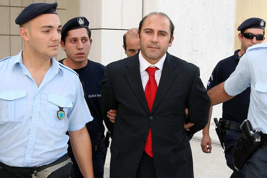 A man being arrested by police.