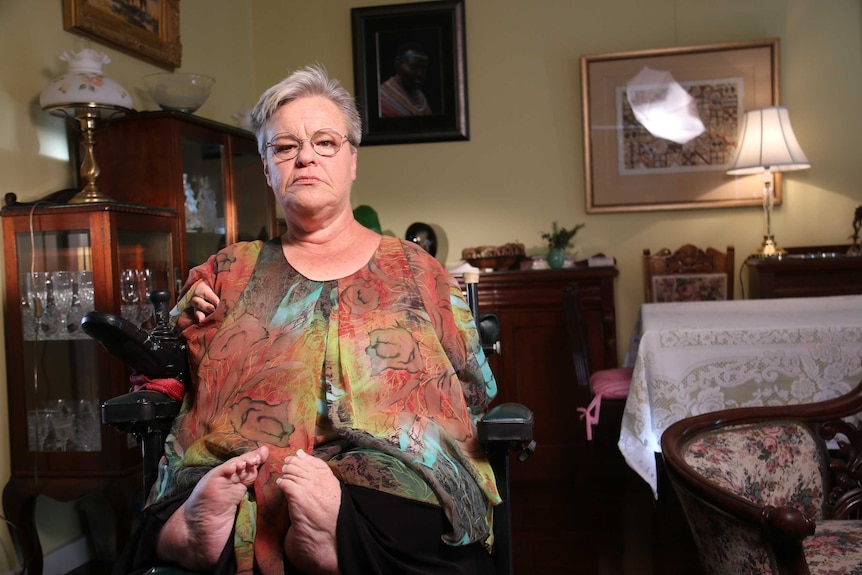 Mary Henley-Collopy sitting in her home