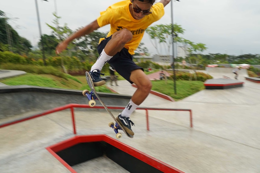 A skater does a trick at a skatepark in Jakarta.