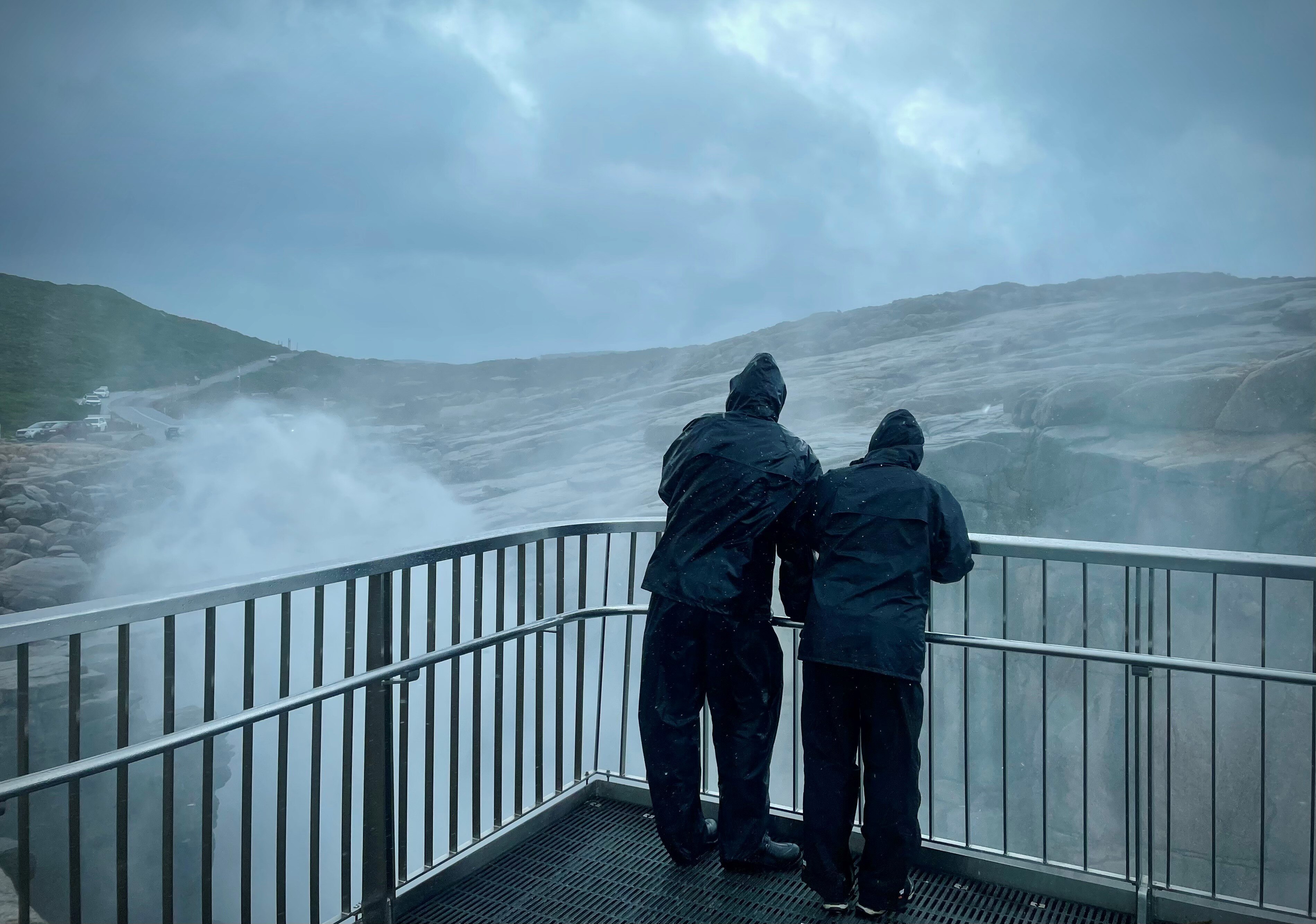 People near ocean spray