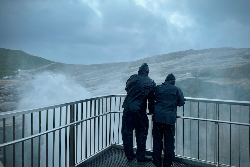 People near ocean spray