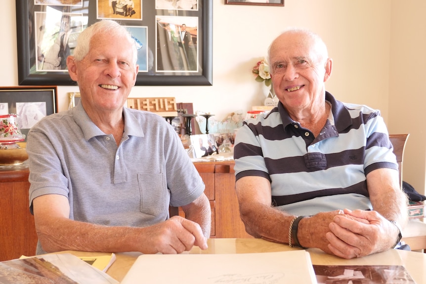 Two men in their 80s at a kitchen table