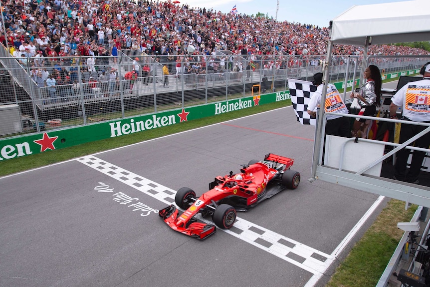 Ferrari's Sebastian Vettel of Germany crosses the finish line to win the 2018 Canadian Grand Prix.