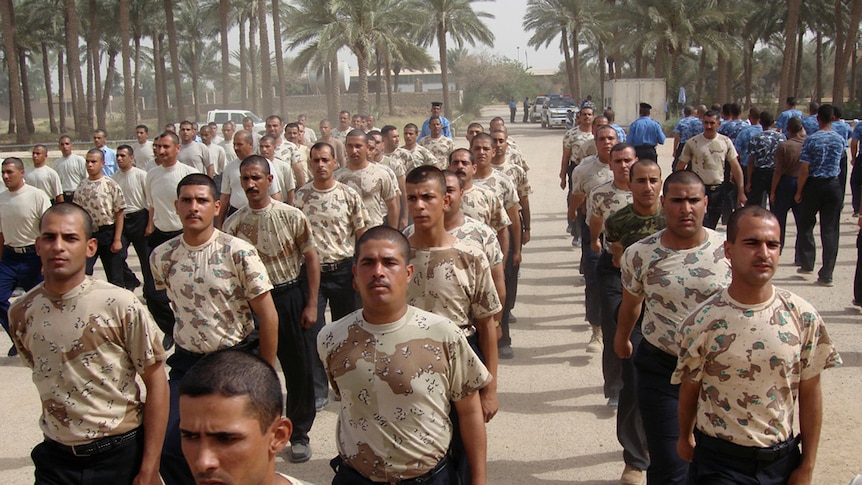 Iraqi police trainees practice marching