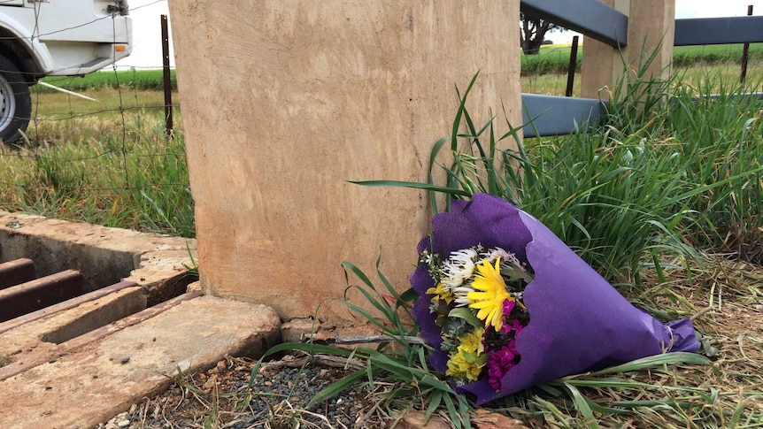 Flowers left at the entrance to the Hunt family property near Lockhart