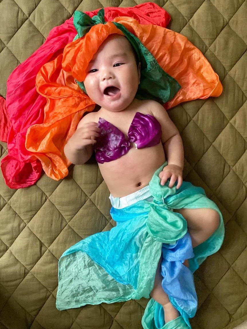 Baby dressed as mermaid