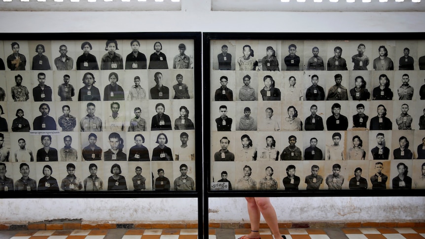 Boards display pictures of victims of the Khmer Rouge regime