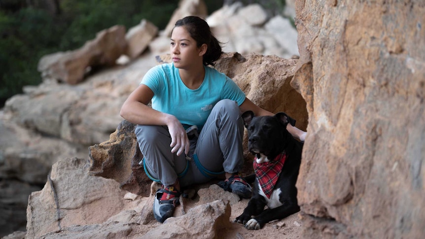 14-year-old Angie Scarth-Johnson prepares to climb a rock face in the Blue Mountains outside Sydney