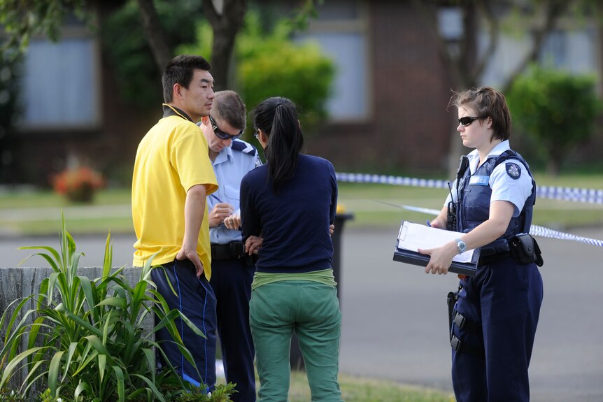 Police outside home where four bodies found