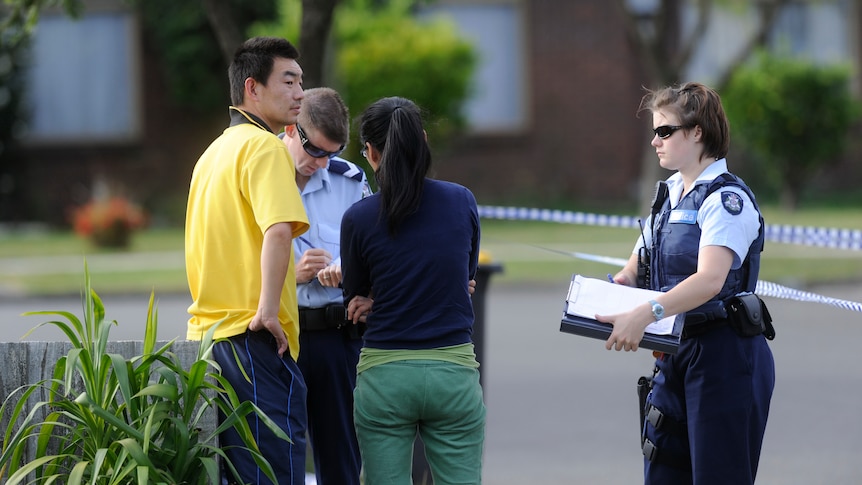 Police outside home where four bodies found