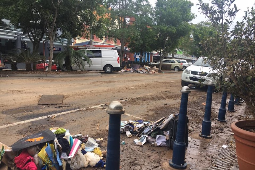 Floodwaters have receded in central Lismore; business owners have moved in and made the first attempts to clean-up.