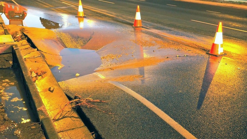 water on the road where a main burst in Adelaide