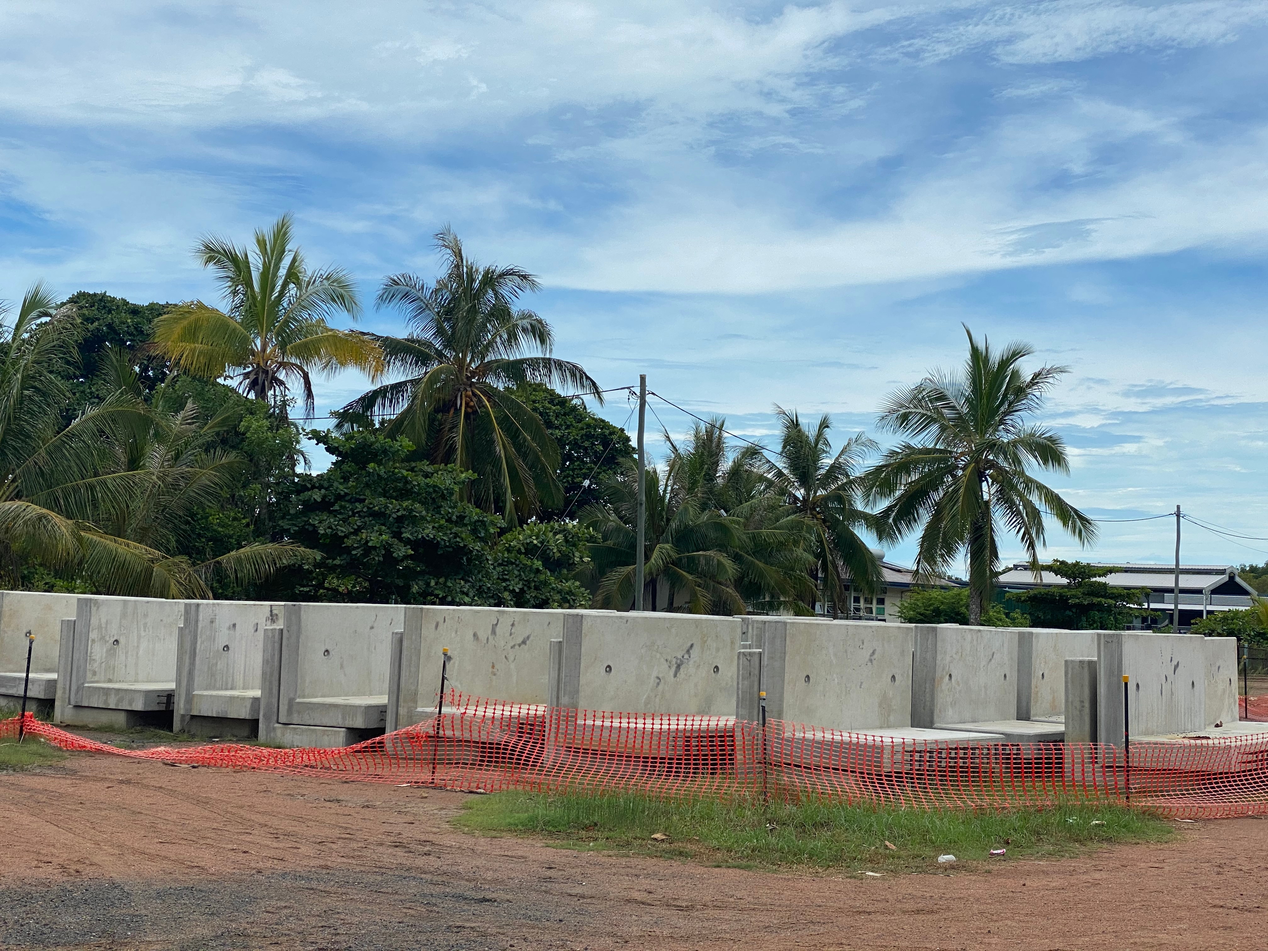 A concrete wall on an island. 