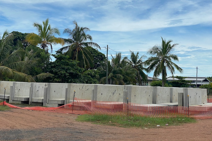 A concrete wall on an island. 