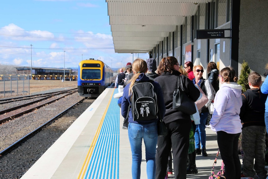 Passengers wait to board the train at Canberra station. July 2017.