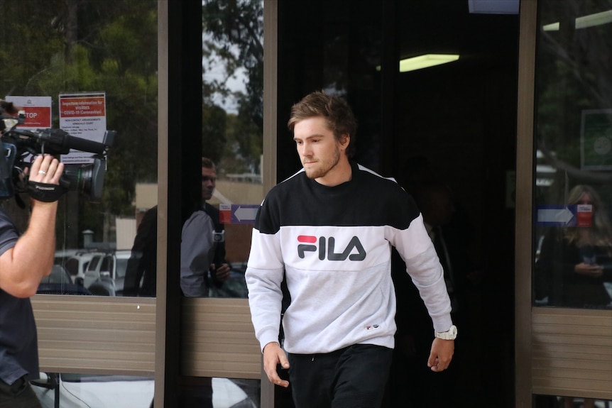 Zayvier Tamer Rose leaves court wearing a sports jumper