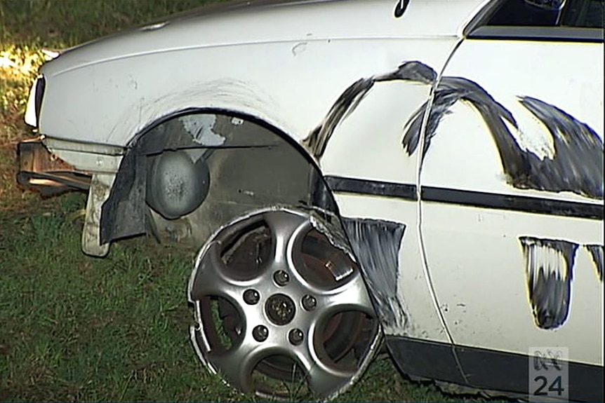 Police say the stolen car continued down the highway on bare rims.