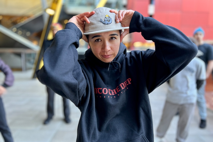 A breakdancer looks at the camera 