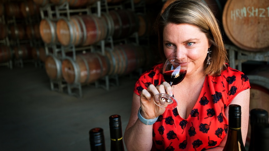 Hanging Rock winery general manager Ruth Ellis drinking a glass of red wine