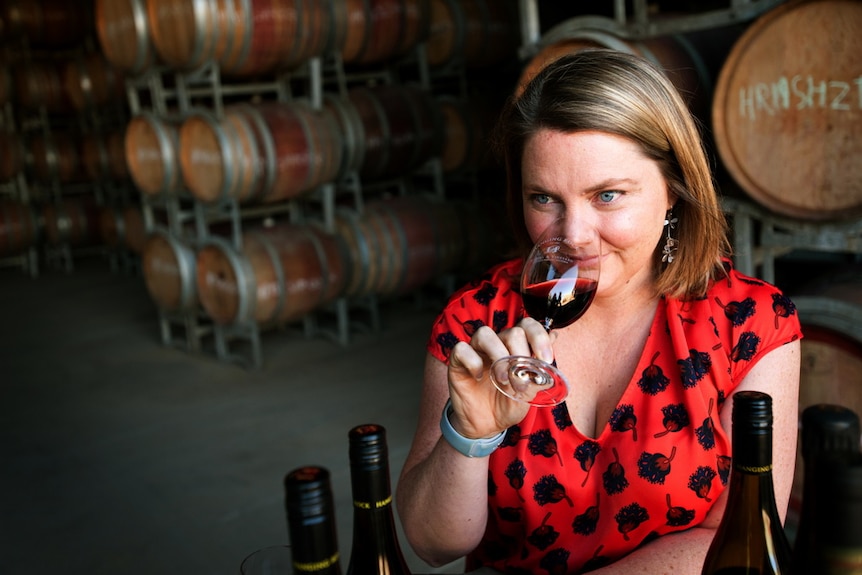 Hanging Rock winery general manager Ruth Ellis drinking a glass of red wine