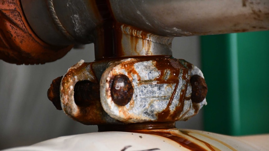 An extreme close up of a rusty connection.