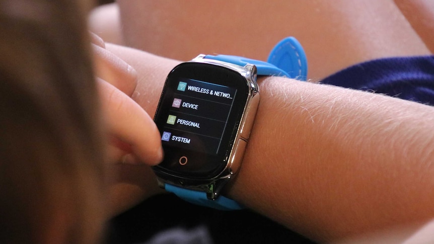 Close up of a smart watch, as worn by a seven-year-old boy.