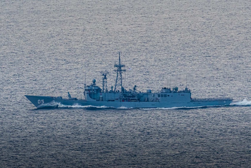 Navy ship seen from a lighthouse.