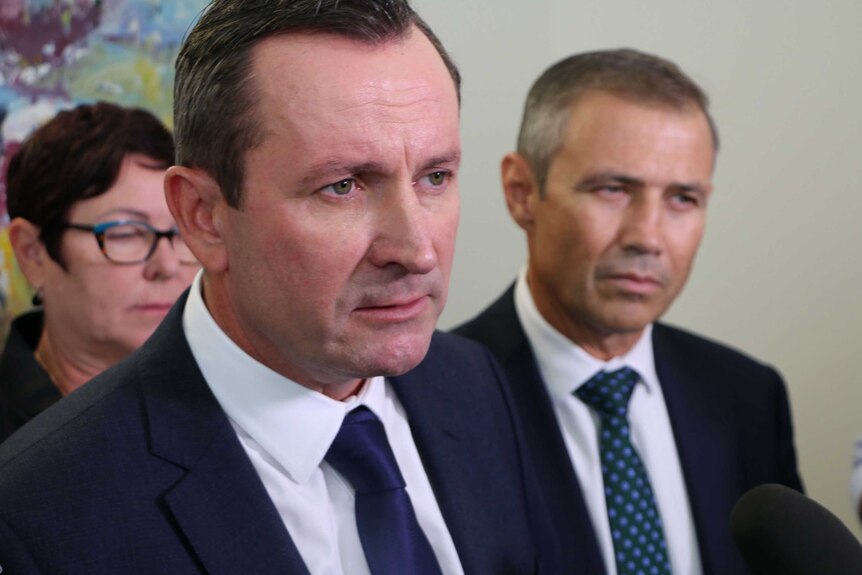 Headshot of WA Opposition Leader Mark McGowan with Roger Cook in background.