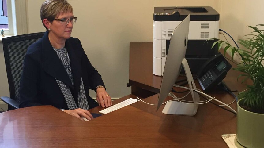 Dr Meredith Craigie at her desk.