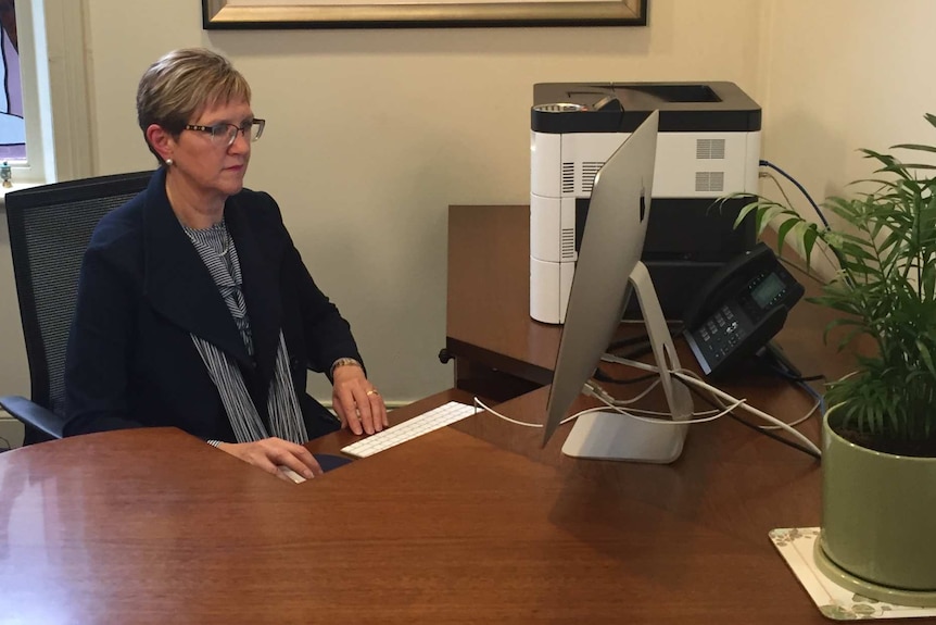 Dr Meredith Craigie at her desk.