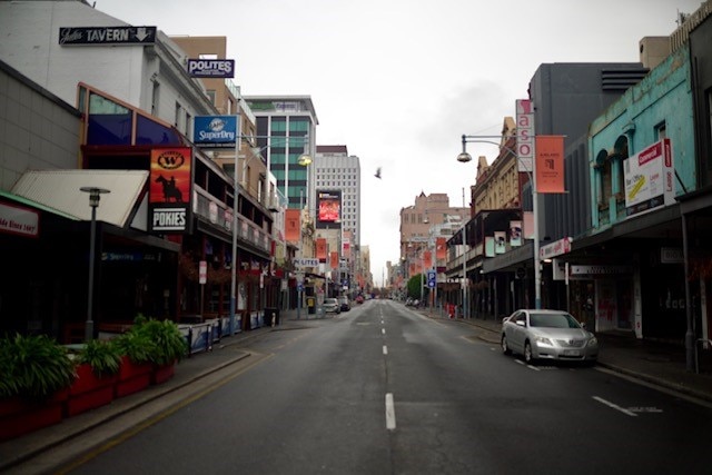 A street with lots of shops but no people