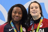Simone Manuel and Penny Oleksiak with their gold medals.