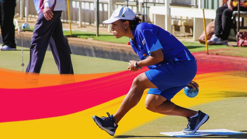 Female lawn bowler in competition uniform in mid-delivery of the bowl in a story about the benefits of playing lawn bowls.
