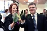 Prime Minister Julia Gillard and local member Darren Cheeseman display green hands
