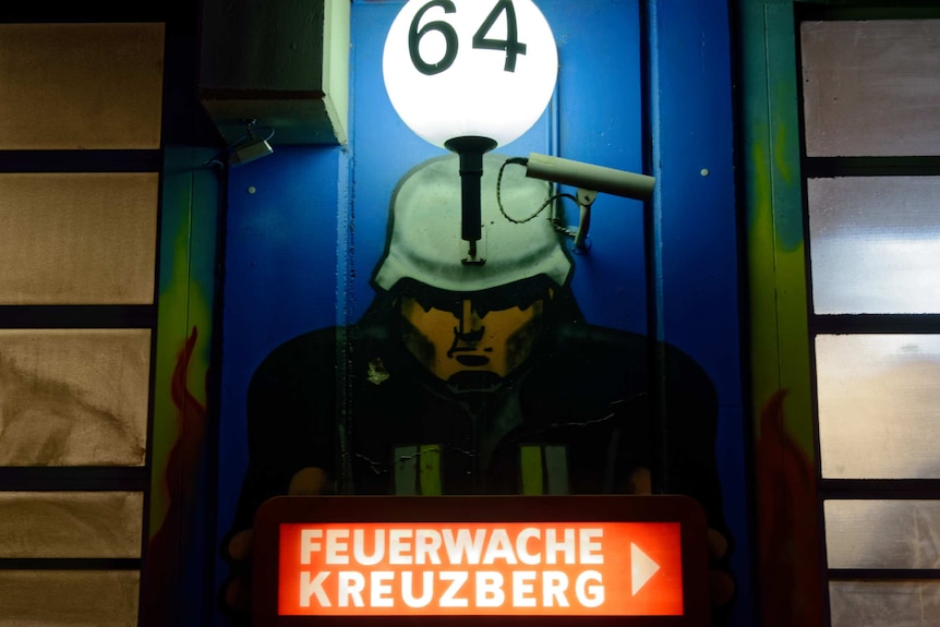 An image of a soldier is graffitied on a fire station in Berlin.