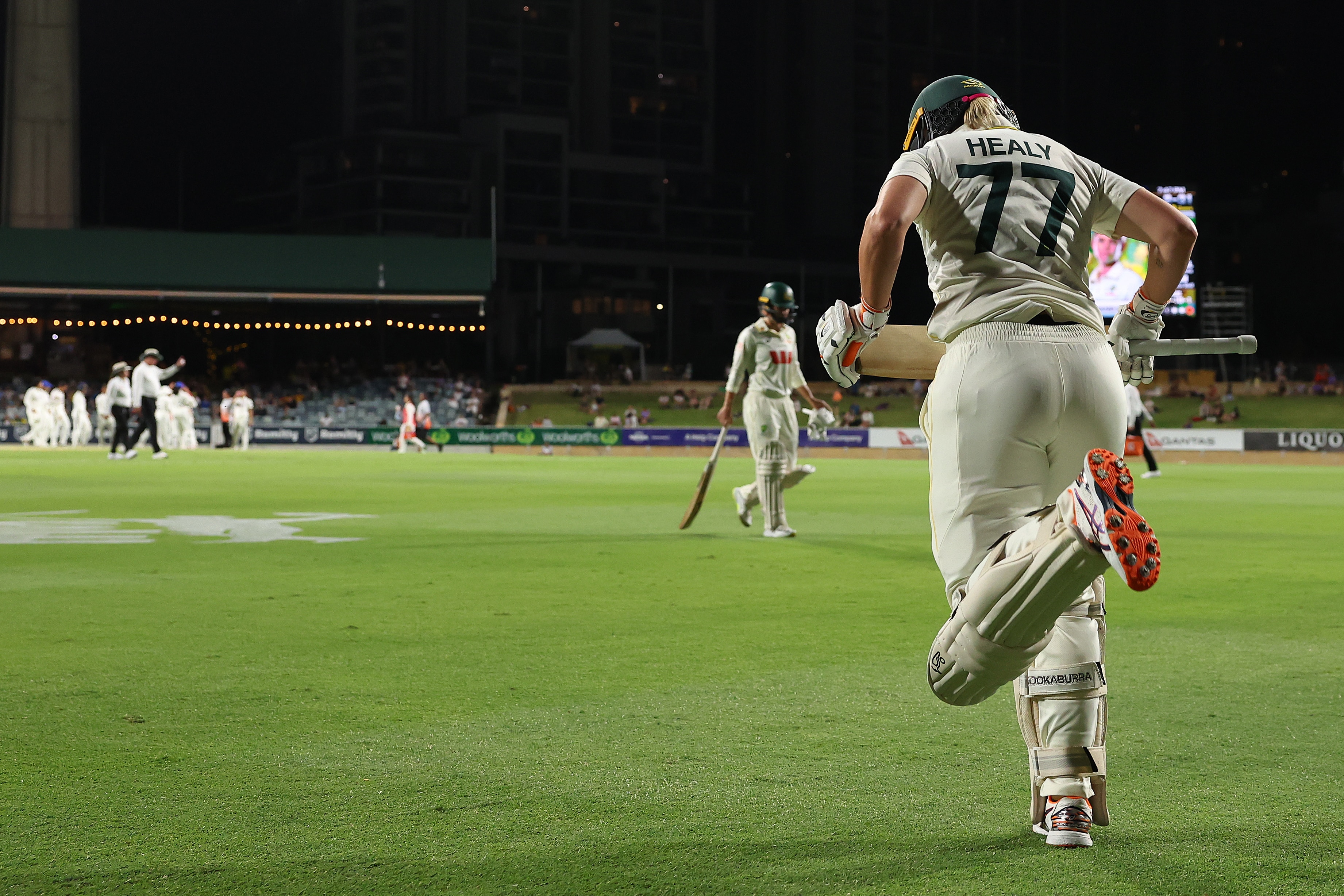 Alyssa Healy runs out to bat in a day-night Test at the WACA.