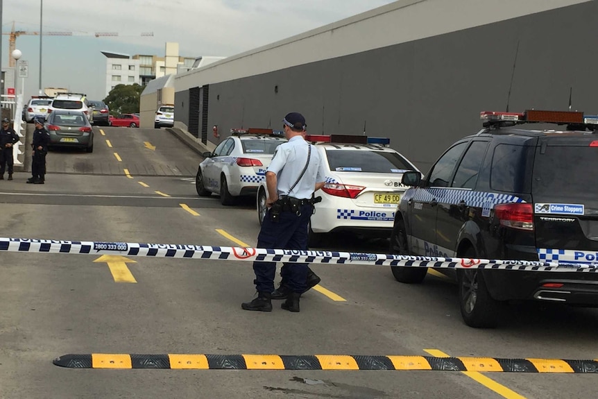 The scene of the Bankstown shooting is cordoned off by police