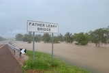 A bridge in the Daly River is close to flooding over.