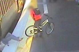 Woman falls under a train at a station at Darra in Brisbane.