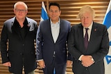 Scott Morrison, Danny Danon and Boris Johnson stand in a line in front of the Israeli flag