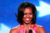 Michelle Obama addresses delegates during the first session of the Democratic National Convention.