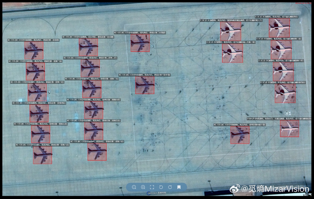 A satellite image showing planes in rows.