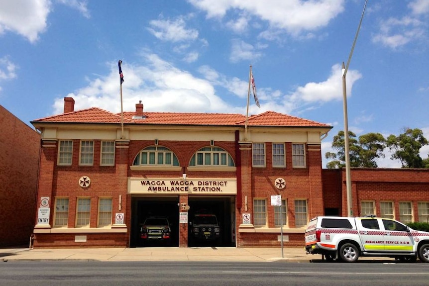 The historic Wagga Wagga ambulance station pictured with ambulances parked insuide and on the street