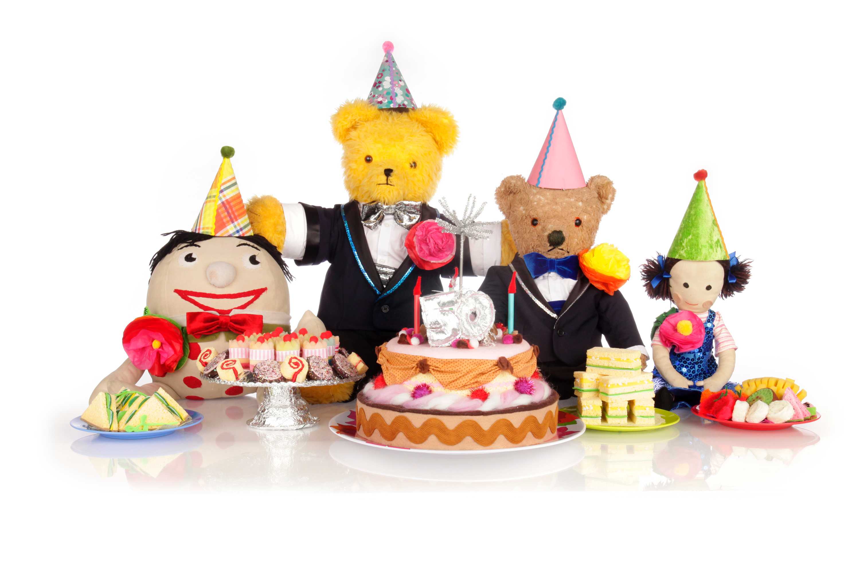 Play School stuffed toys Humpty, Big Ted, Little Ted and Jemima celebrate 50 years on TV with party hats, cakes and sandwiches.