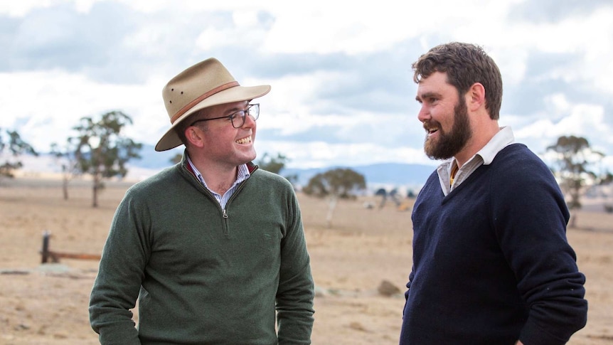 NSW Agriculture Minister Adam Marshall speaking to a farmer in Guyra.