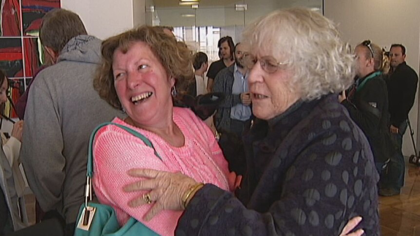 Two women celebrate after the introduction of the ACT's bill to legalise same sex marriage.