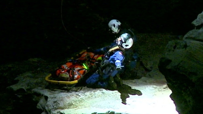 The two rescuers communicating to the helicopter during the rescue