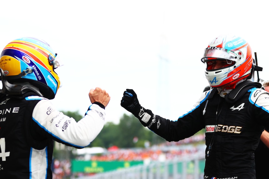 Fernando Alonso celebrates with race winner Esteban Ocon